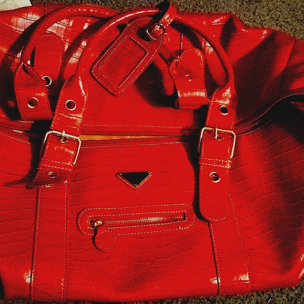 This is a rare Prada red crocodile bag